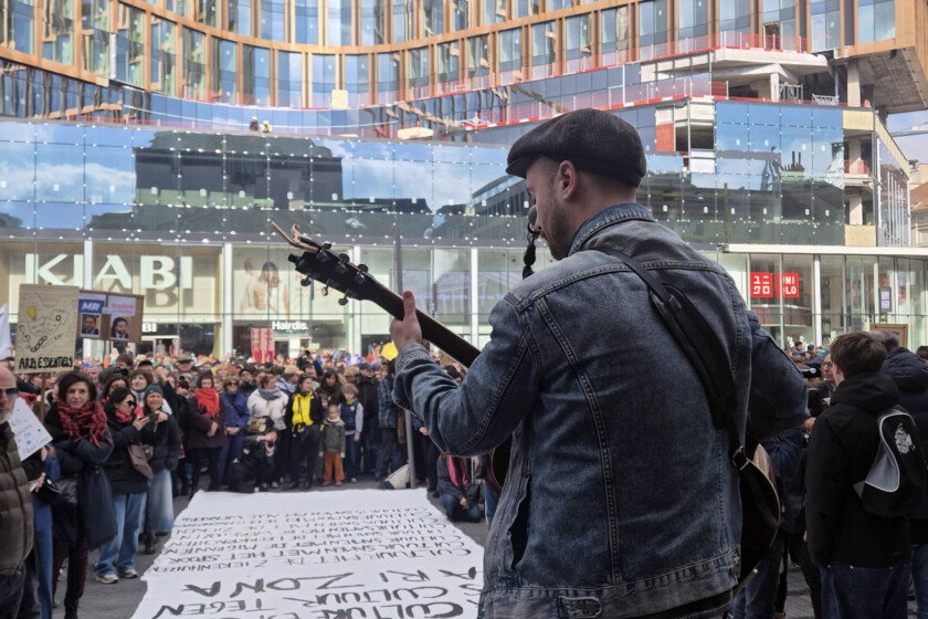 Workers and sympathizers of the cultural sector gather at the Muntplein - Place de la Monnaie square in Brussels for an action during a national strike of socialist trade union FGTB/ABVV and Christian union CSC/ACV, Monday 31 March 2025. The strike is part of a national day of action to protest against the austerity and pension reforms of the federal government. BELGA PHOTO TIMON RAMBOER